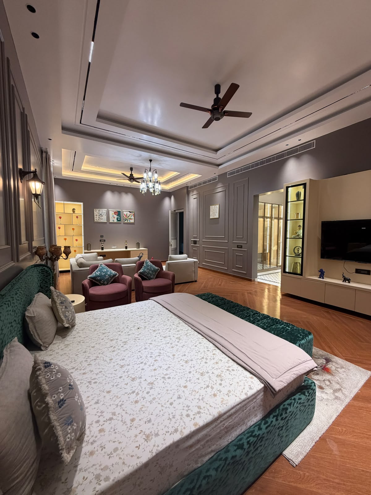 Spacious master bedroom with curated Indian decor