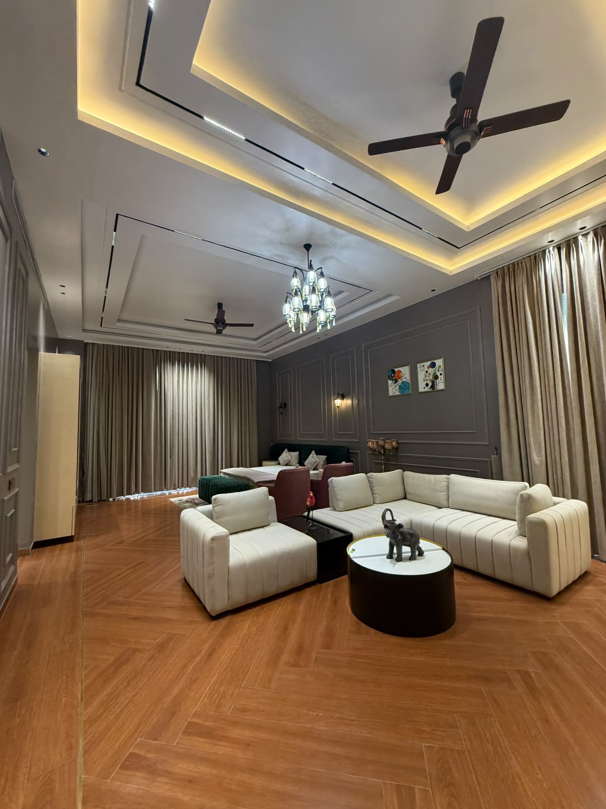 Elegant private suite lounge with warm cove lighting